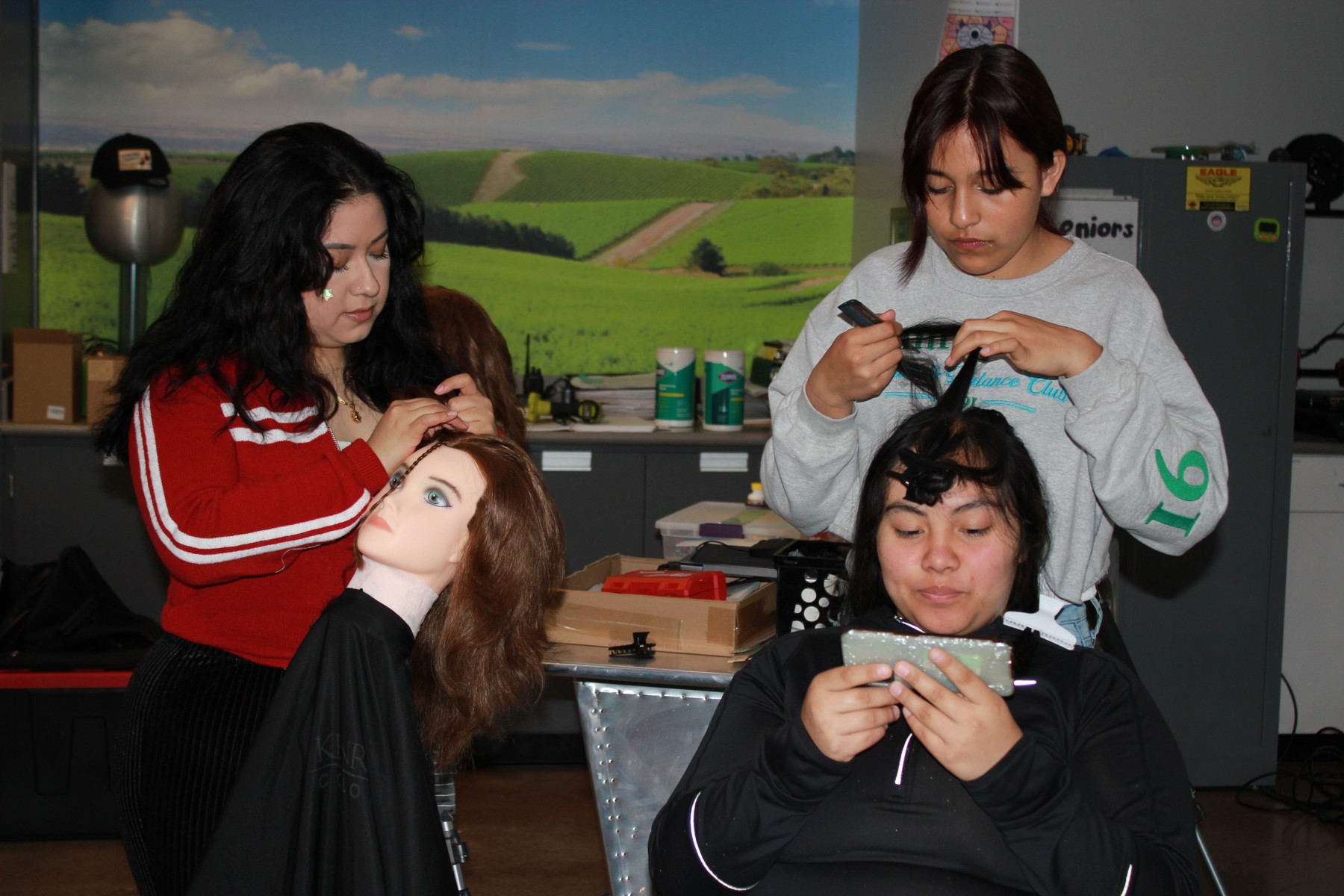 Magnolia program photograph: students practicing beauty skills together