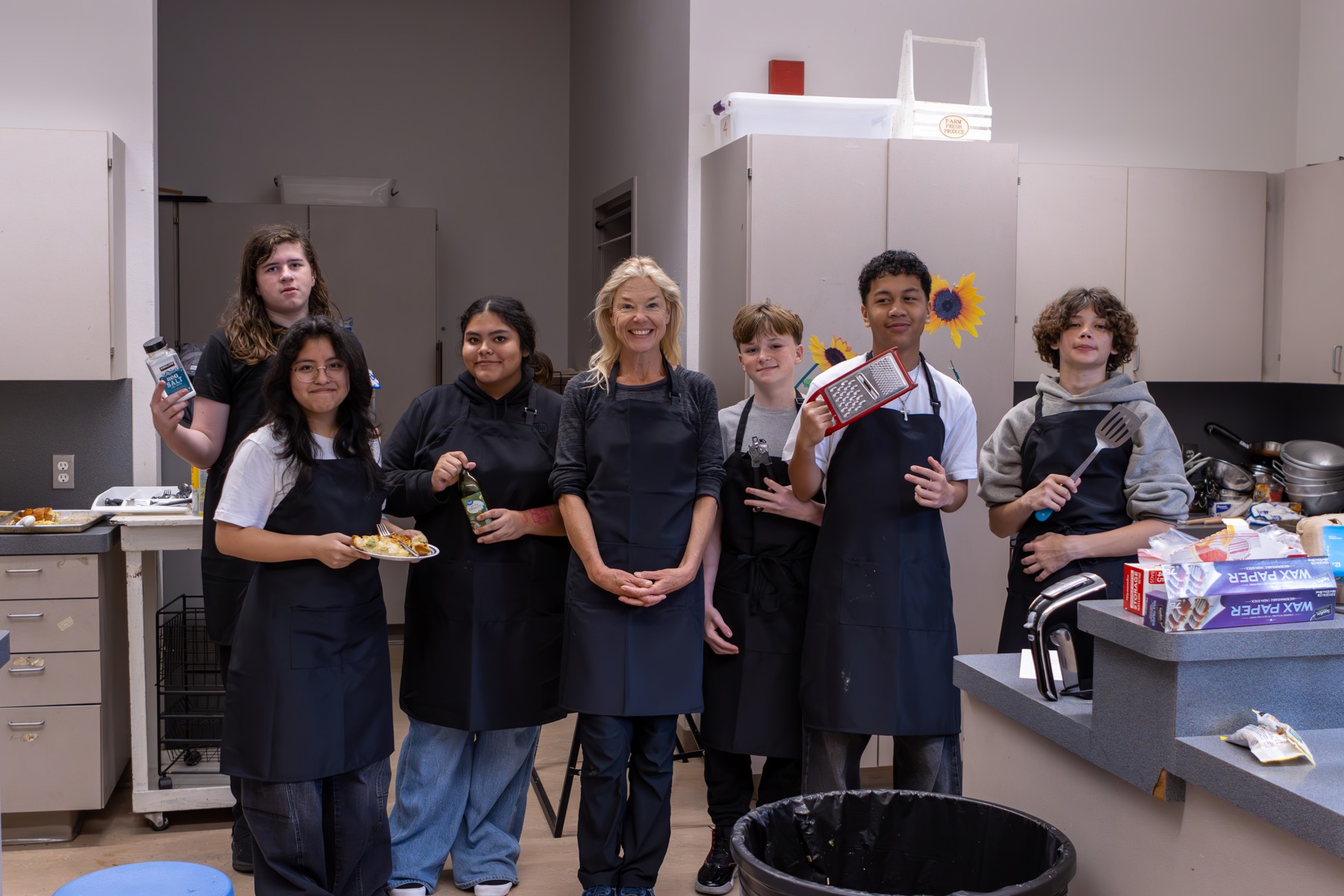 Students and mentors together in a teaching kitchen