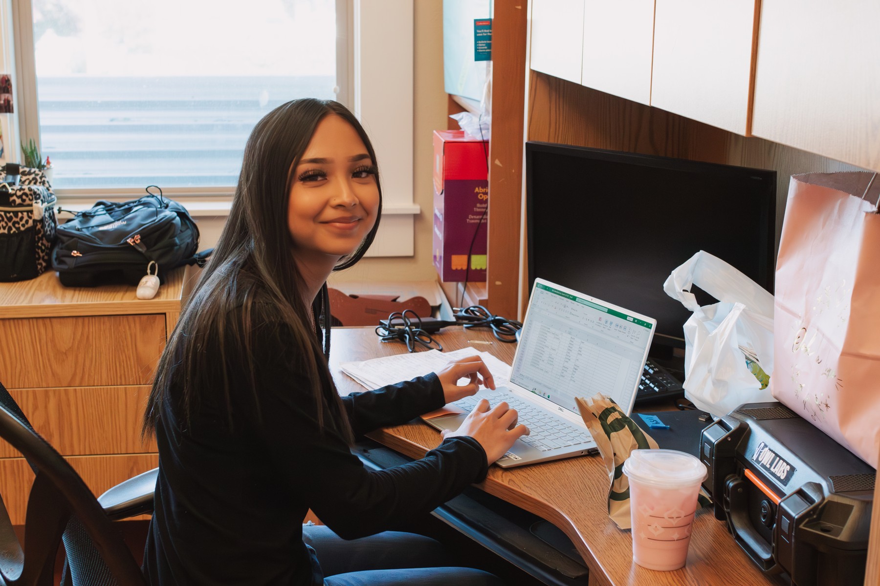 A participant working at a laptop in an office