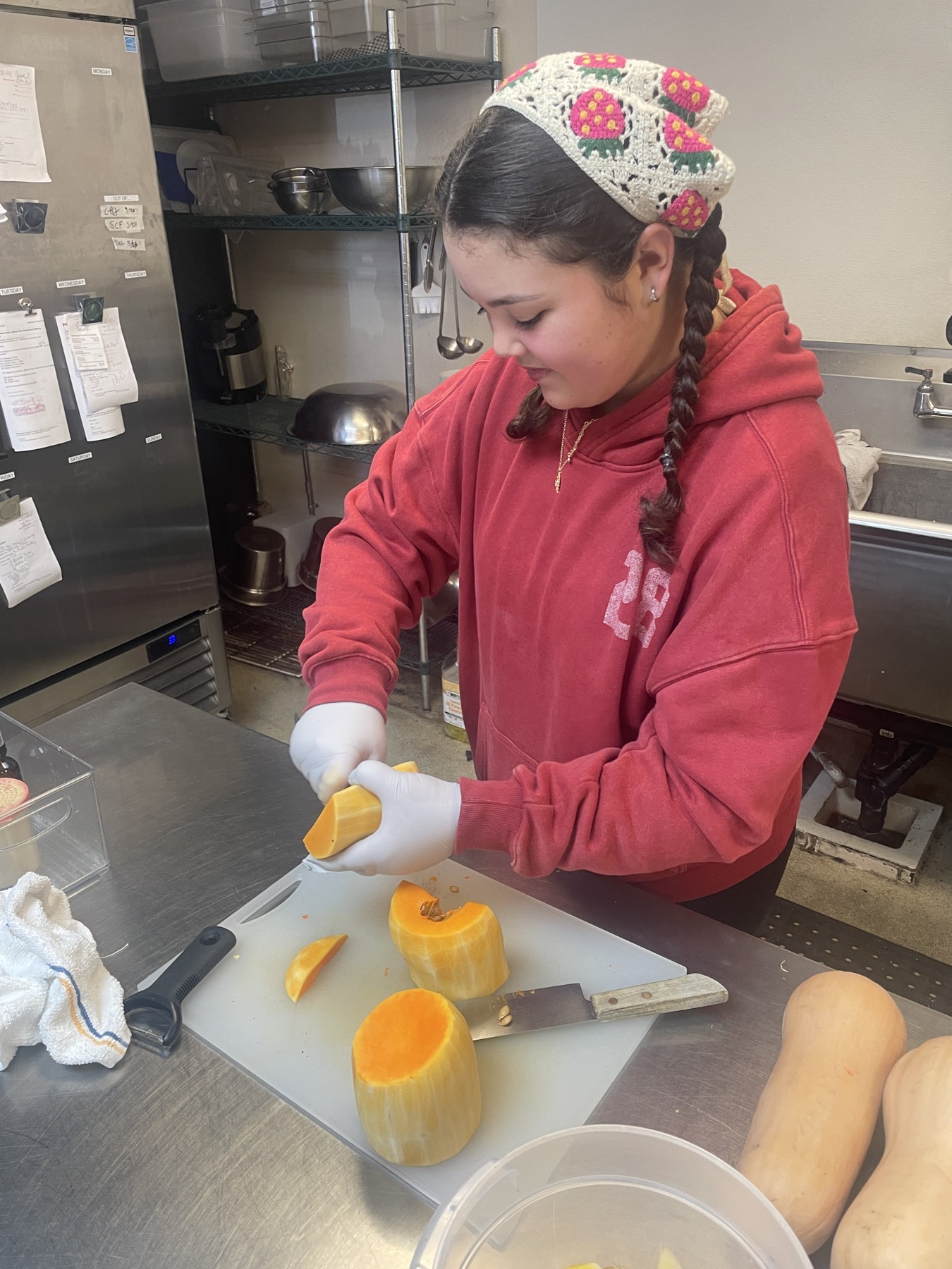 A student preparing ingredients in a kitchen