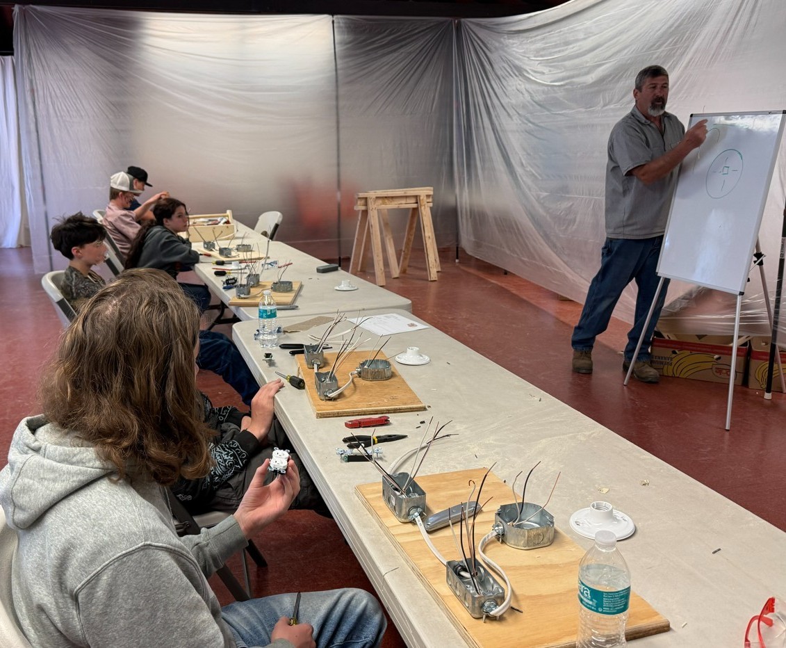 Students learning together in a classroom workshop
