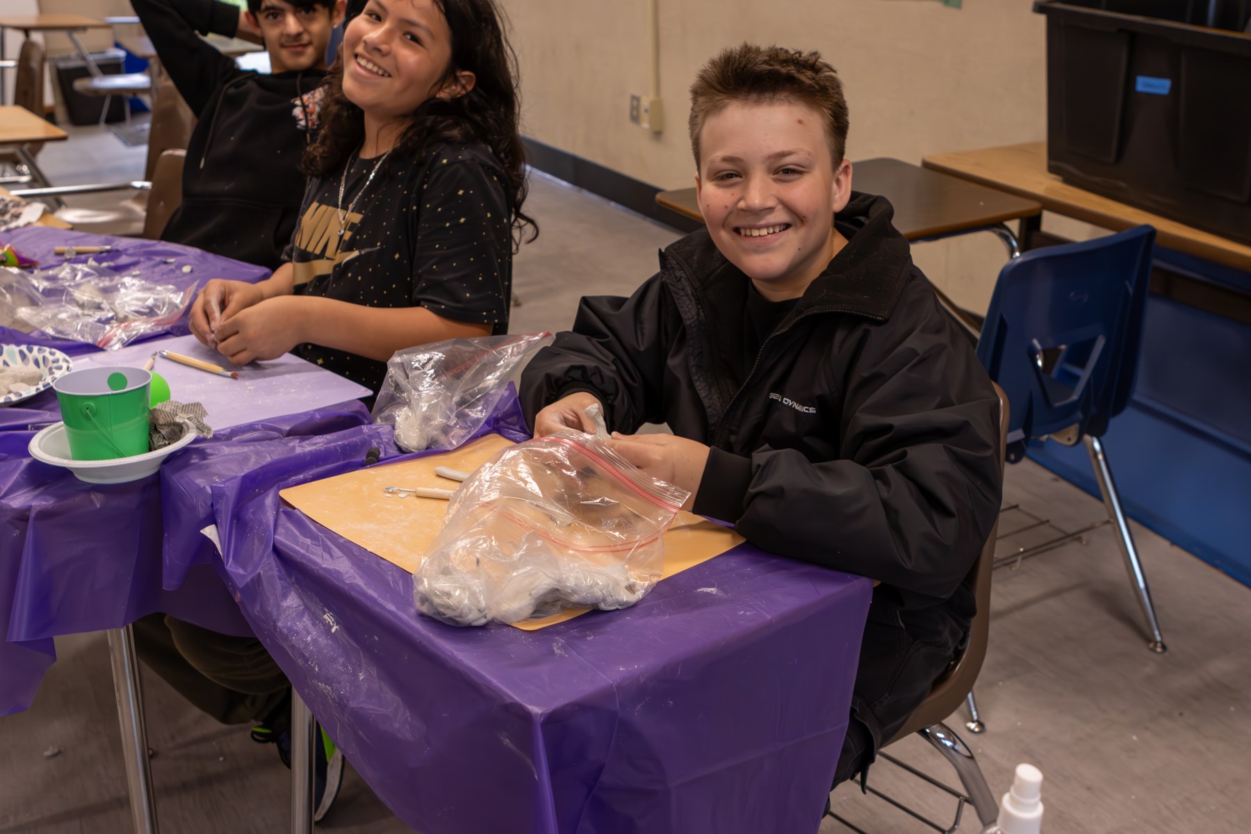 Students working on colorful art projects